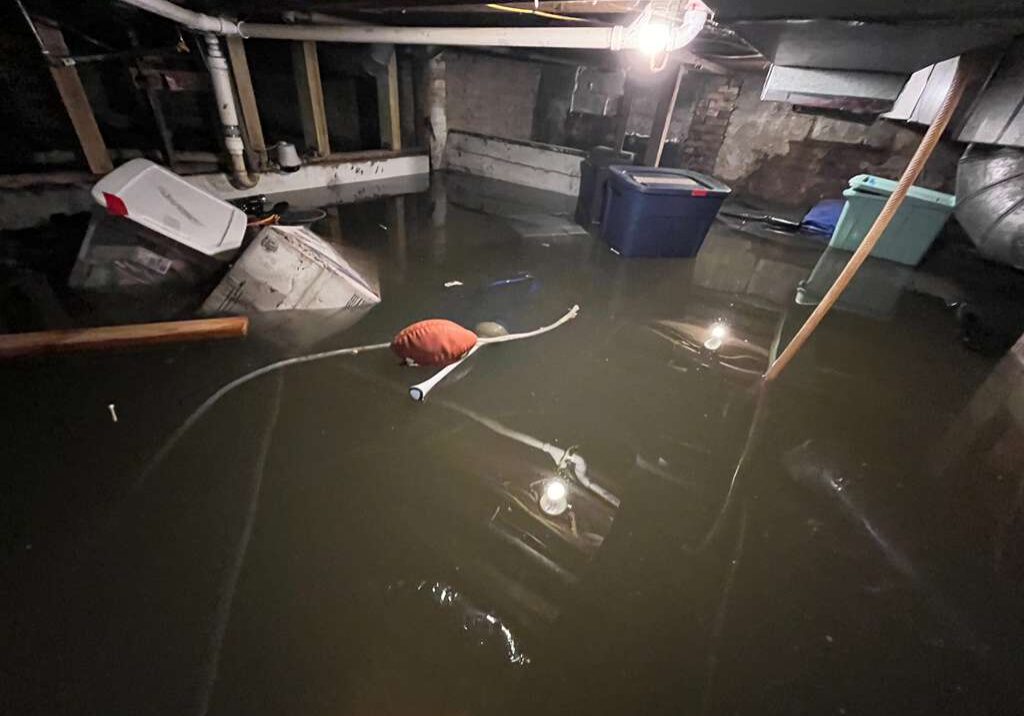 Assessing a flooded basement in Grand Rapids